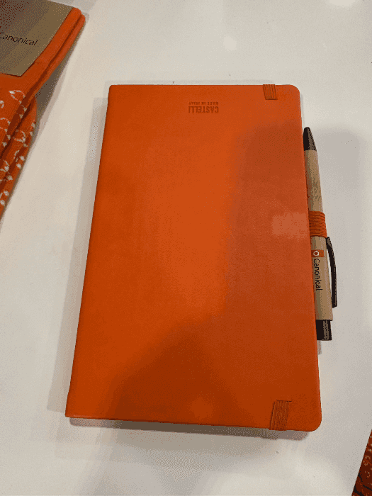Orange notebook and pen